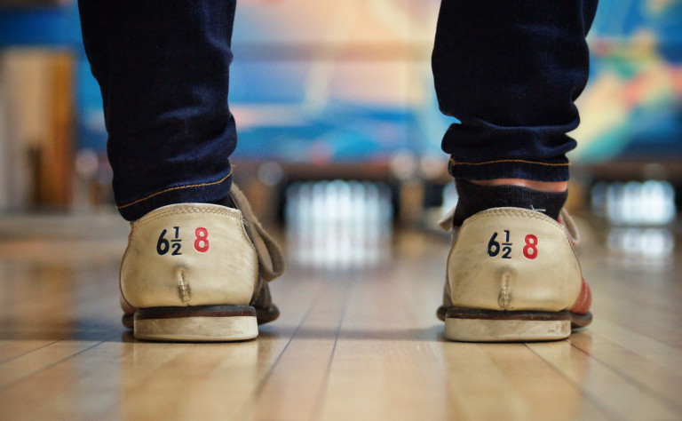 man with bowling shoes