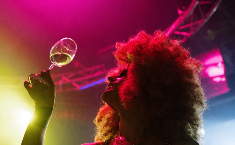 Drag Queen on Stage with wine glass