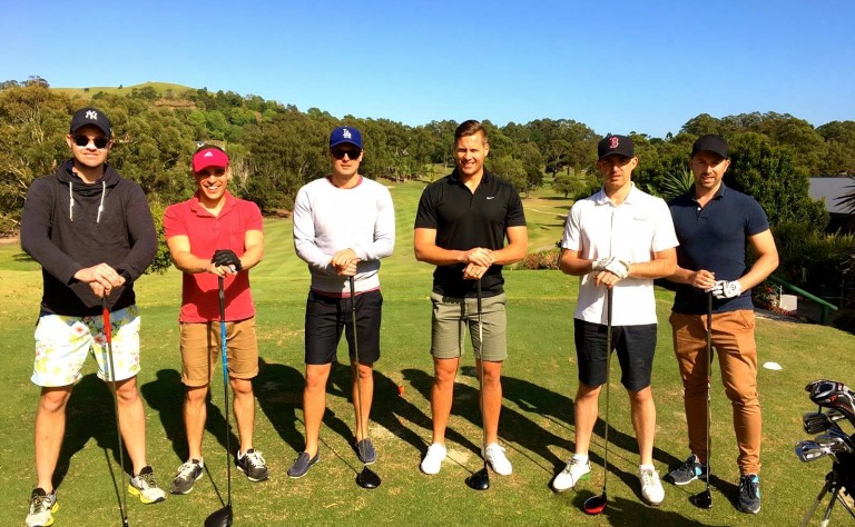 lads playing golf